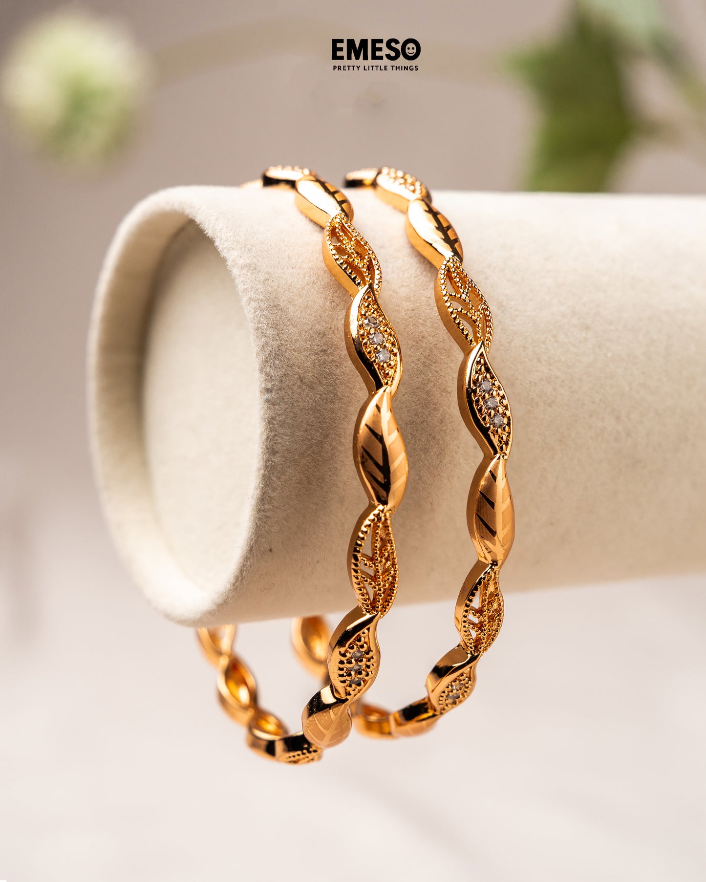 Gold tone white stone bangles